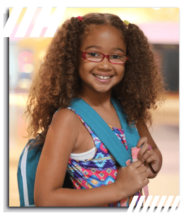 Young Girl Smiling and Wearing a Backpack